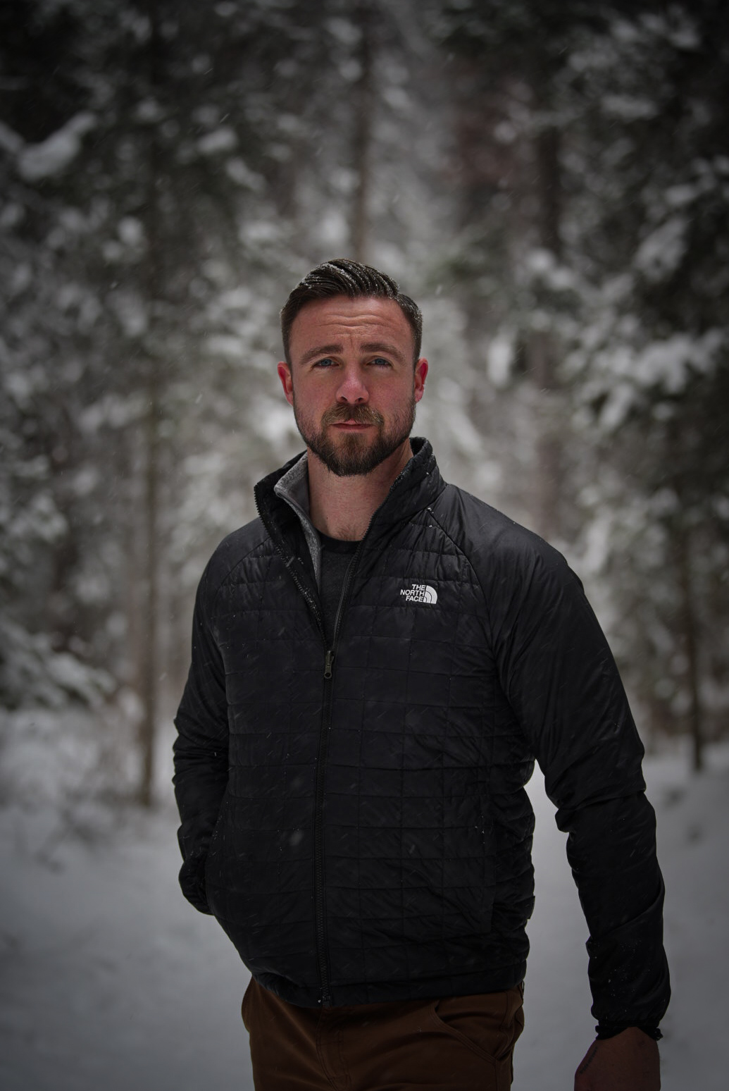Chris Craft, founder of Craft Builders, in a snowy Northwest Montana forest.